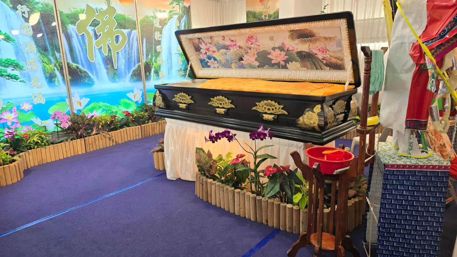Singapore Buddhist wake setup — full altar, casket, traditional offerings