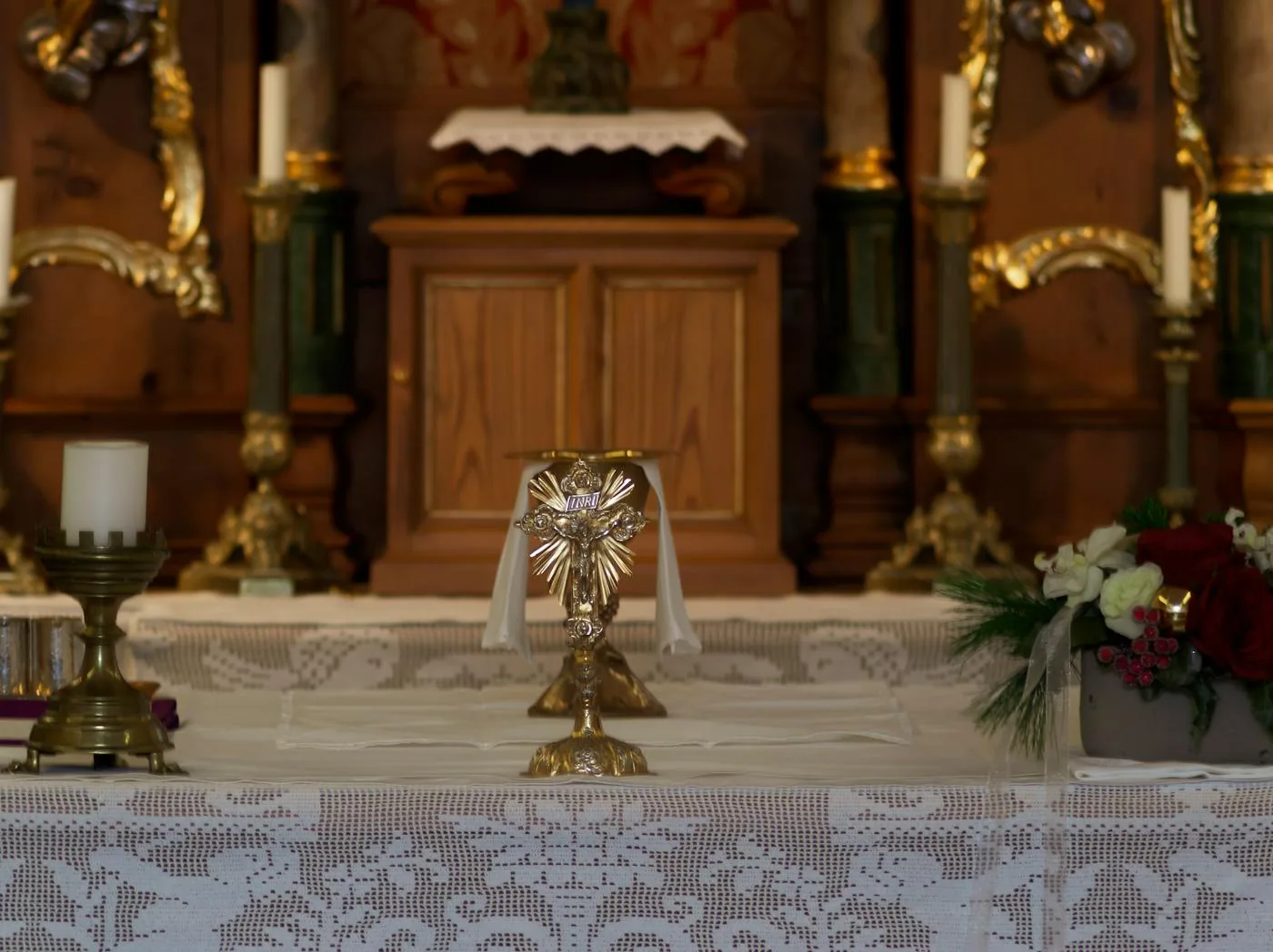 Christian church altar with candle and cross